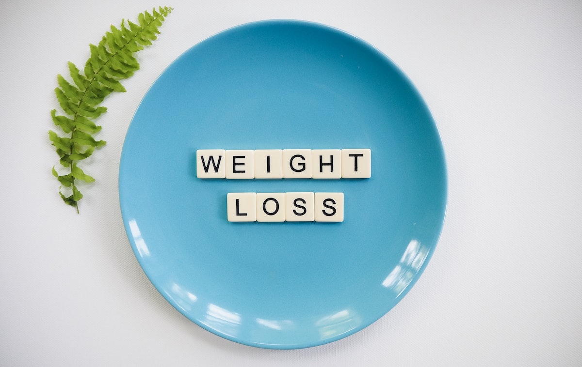 weight loss spelling out on a plate